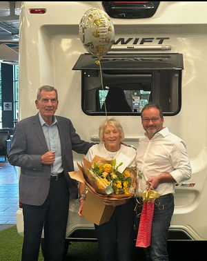 Jean Courtney receives gifts from Salop Leisure’s chairman Tony Bywater (left) and joint managing director Mark Bebb