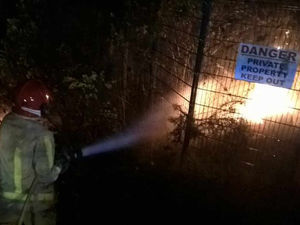 Supporting image for story: Pictures: Fly-tipping fire spreads to bushes