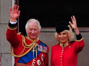 The King and Queen on the Buckingham Palace balcony (PA)