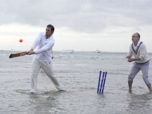Supporting image for story: In Pictures: Waterlogged pitch perfect for cricketers playing annual game in sea