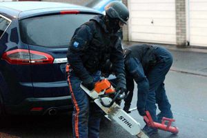 A chainsaw was used to cut a hole in a front door