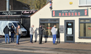 Customers queue for their long awaited trim at Little Nick's Barbers, Salters Road, Walsall Wood