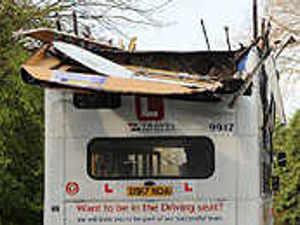 Supporting image for story: Bus loses roof in smash