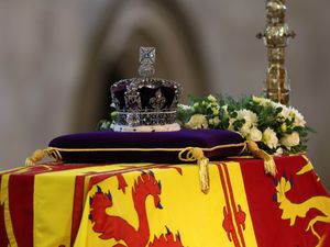 Supporting image for story: Lying in state: Visitors take a few moments to say goodbye to the Queen