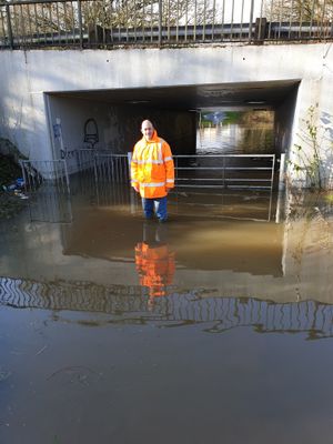 David Phillips at the flooded underpass between Mounway and Parkway in Brookside