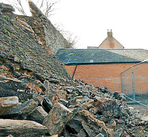 Portions of Ludlow Town Walls fell down during the night crushing a vehicle parked next to them. Shropshire Councillor Martin Taylor-Smith and council employees make safe the damage.
