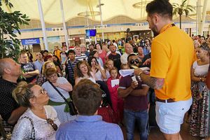An EasyJet worker talks to stranded tourists
