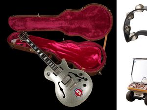 Supporting image for story: Oasis: Noel Gallagher’s golf buggy and Liam Gallagher’s tambourine go to auction