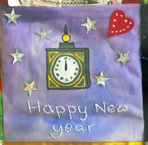 New Year greetings with a clock at midnight