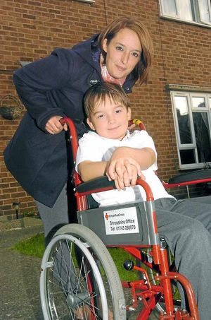 Tara Mellings with her eight-year-old son Euan in his wheelchair