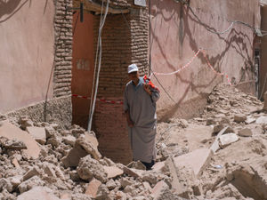 A man inspects damage caused by the earthquake as he walks in the old Medina of Marrakech, Morocco