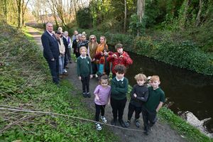 Parents, pupils and local councillor Carl Rowley on the towpath in question. Photo: Steve Leath