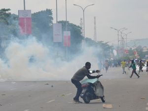 Supporting image for story: Nigerian leader demands end to protests over hardship which have turned violent