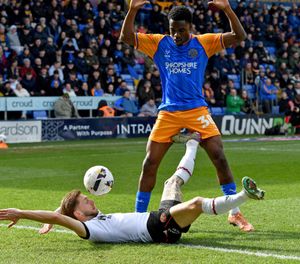 Shrewsbury Town’s Kevin Berkoe in action against Walsall