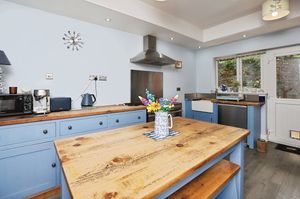 The kitchen is a good size, with period features