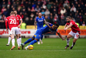 Shrewsbury Town's Chey Dunkley and Wrexham's Elliot Lee