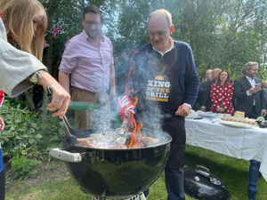 Liberal Democrats leader Sir Ed Davey, flipping burgers in a back garden on the General Election campaign trail in Wiltshire