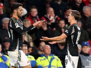 Mikel Merino celebrates his goal against PSV with Leandro Trossard