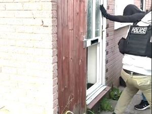 Supporting image for story: Watch: Dramatic footage shows police officers breaking into properties in Cannock as they carry out early morning raids