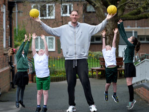 Supporting image for story: Britain's tallest man drops in on Shropshire schoolchildren - with video