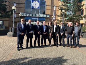 West Midlands' Mayor Richard Parker and Stourbridge MP Cat Eccles, centre, with members of Black Country Radio, right, and the team at Parcap, left.