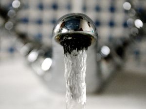 Close-up photo of a running tap