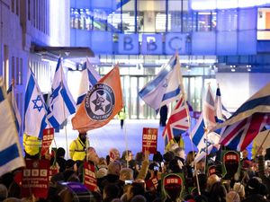 People take part in a protest outside the BBC’s Broadcasting House