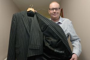 Organiser Dave Reddy with one of Rod Stewart's signed suits