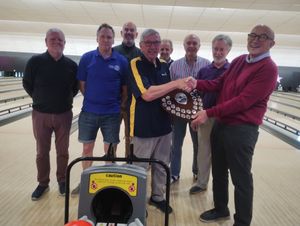 Jacko Page receiving the District 10 trophy 