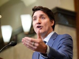 Canadian Prime Minister Justin Trudeau gestures while speaking