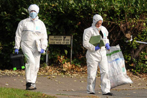Forensic officers at the scene on Monday