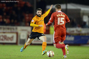 Jack Price of Wolverhampton Wanderers and Dannie Bulman of Crawley Town.