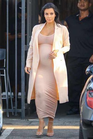 Thumbs down: Kim Kardashian in a very tight nude dress