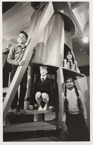 Children from schools in Bilston and Penn were privileged to see a preview of the exhibition, which had recently transferred from London. Peter Vigurs and Woodfield Junior School are mentioned. The photograph shows children from Loxdale Primary School, Bilston, climbing in the Childs Tower Room by Anthony CaroL (from left) Daniel Johnson, Lisa Bailey, Michelle Jones and Parvinder Kaur.