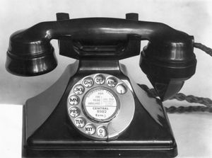 An old rotary dial phone | Getty Images
