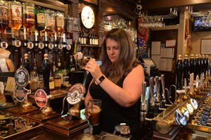 Barmaid Jo Selman pours a pint at the Lychgate Tavern, following on from when the Prime Minister did so
