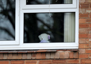 People who live along the procession route were encourages to place teddy bears in the windows of homes