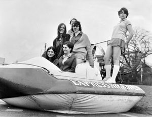 January 20, 1968, the caption reads: 'In two weeks' time, a hovercraft rally is to be held at Meole Brace Secondary Modern School, Shrewsbury. Today two competitors arrived at the school for a dry run. To show the versatility of this air rider, eight pupils hopped aboard and floated around the playground.'  
