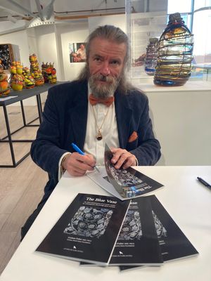 Graham Fisher signing his book about The Blue Vase