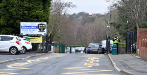 A police officer outside Ellowes Hall Sports College, Dudley