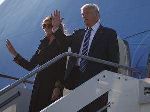 Supporting image for story: Melania Trump appeared to bat Donald Trump's hand away - again 