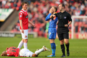 Shrewsbury Town's Joseph Mills sees red