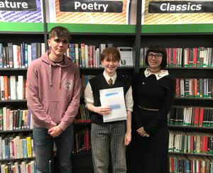 Pearl (centre) with last year's Young Poet Laureate Harry Fletcher (left) and the county's current Poet Laureate Scarlett Ward (right).