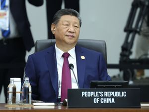 Supporting image for story: China’s Xi promises to protect free trade at Apec as Trump snubs major summit