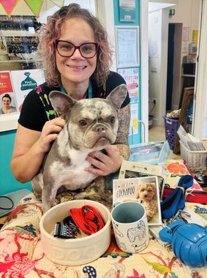 Beckie Harrison, manager of Severn Hospice's shop in Bicton, with her dog Willow