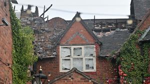A police scene guard remains in place at The Oxon Priory on Welshpool Road as investigations continue into the cause of the blaze