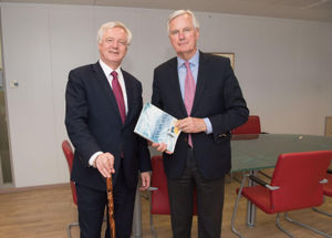Brexit Secretary David Davis exchanging mountaineering gifts with European Commission's chief negotiator Michel Barnier