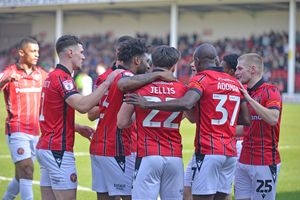 Ellis Harrison celebrates his opening goal during Walsall's clash with Grimsby.