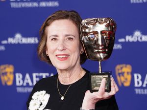 Kirsty Wark holds her Bafta