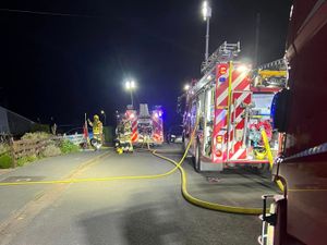 Supporting image for story: Two people treated by paramedics after late night house fire breaks out